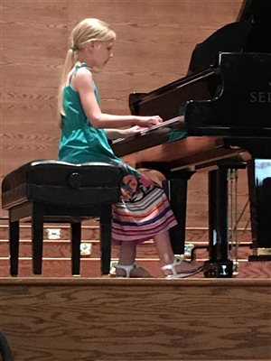 Student performing in studio recital
