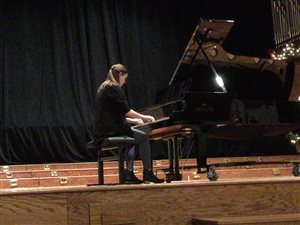 High-school student performing in studio recital
